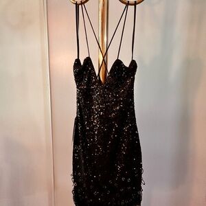 Black evening dress w/ thin strap that makes X at the back. New. High quality.